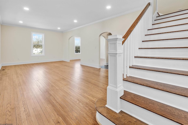 interior space with wood-type flooring and ornamental molding