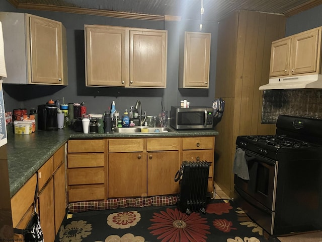 kitchen with black gas range oven, dark tile patterned floors, ornamental molding, and sink