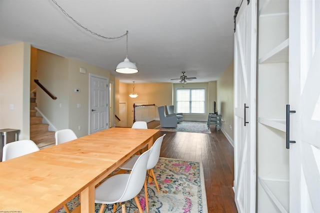 dining space featuring ceiling fan and dark hardwood / wood-style floors