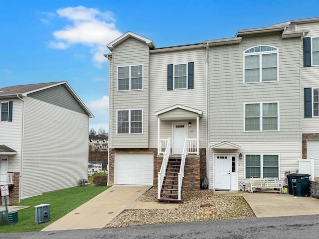 multi unit property featuring a garage