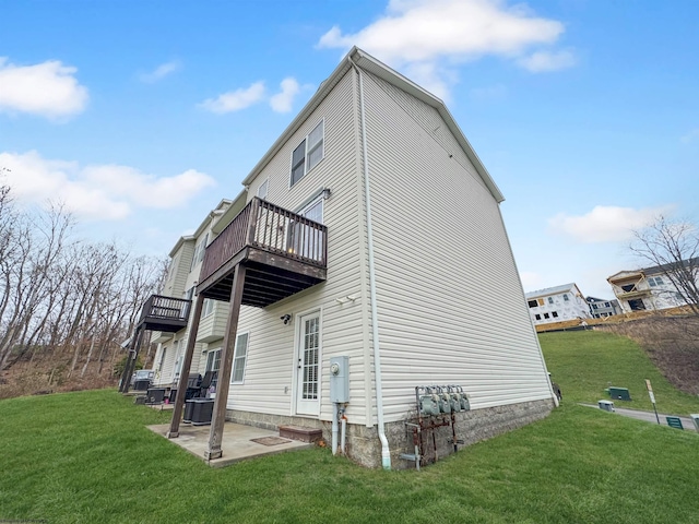 back of house with a yard, a balcony, cooling unit, and a patio