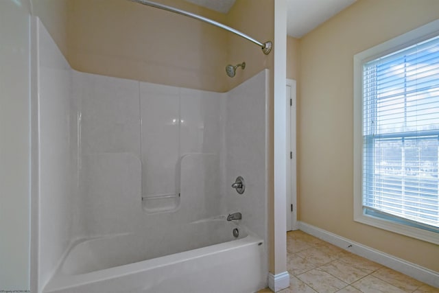 bathroom featuring tile patterned floors and  shower combination