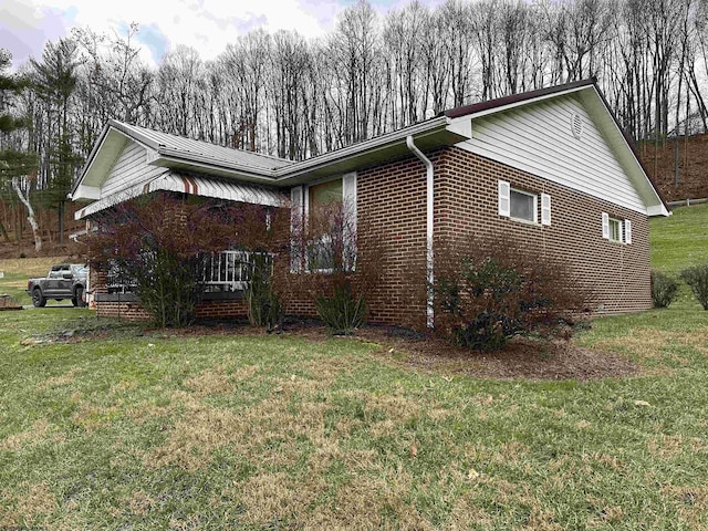 view of property exterior with a lawn