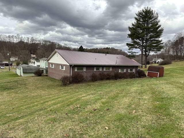 view of property exterior featuring an outbuilding and a yard