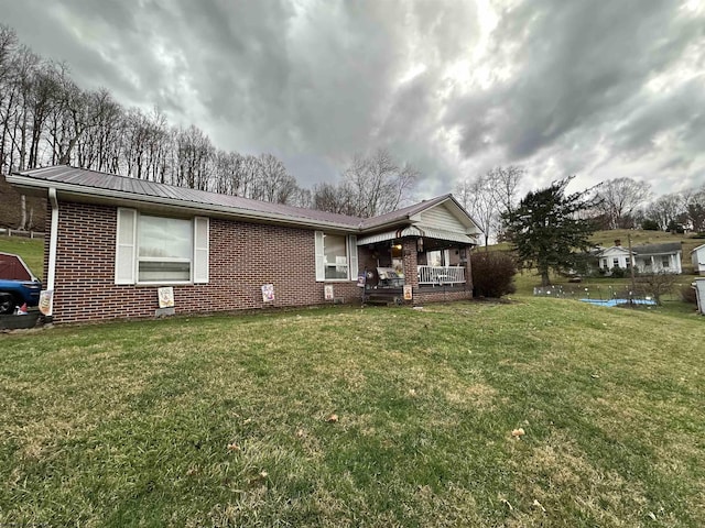 ranch-style home with a porch and a front yard