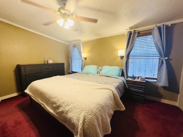 carpeted bedroom featuring a textured ceiling, ceiling fan, and crown molding