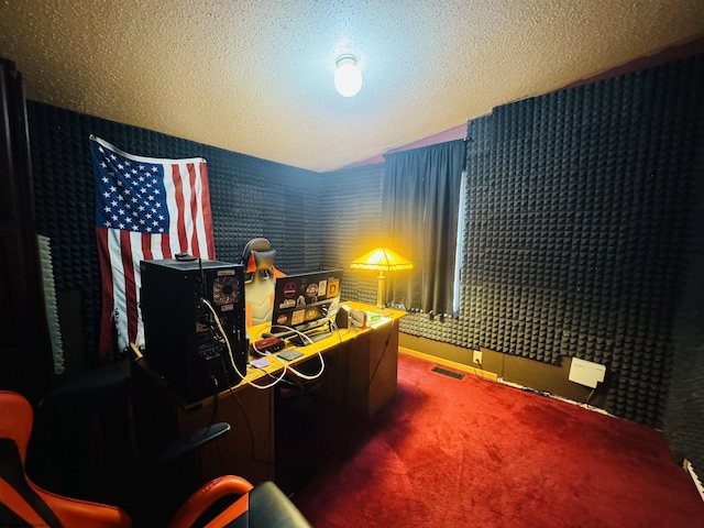 office area with carpet flooring, a textured ceiling, and lofted ceiling