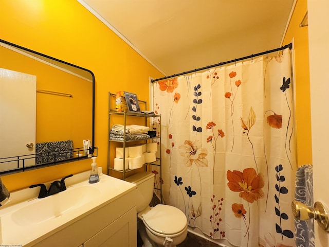 bathroom with a shower with curtain, toilet, ornamental molding, and vanity