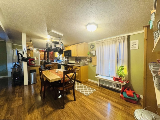 dining area featuring hardwood / wood-style floors and a textured ceiling