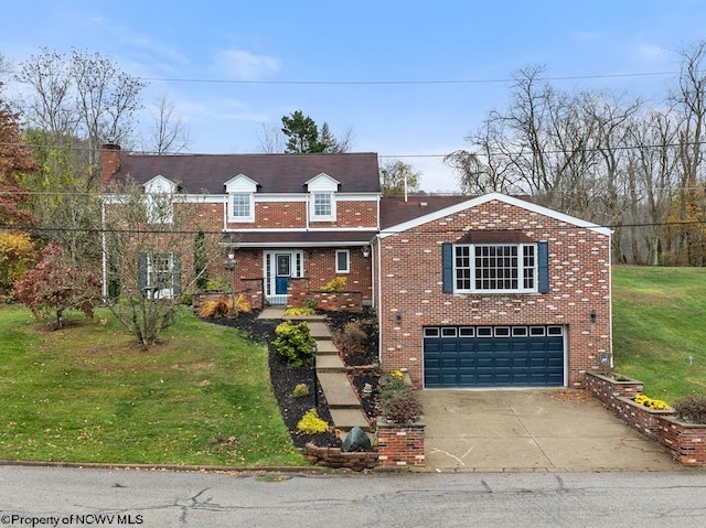 view of front of home featuring a front yard and a garage