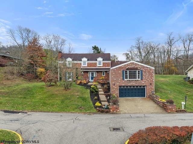 view of front of home with a front yard and a garage