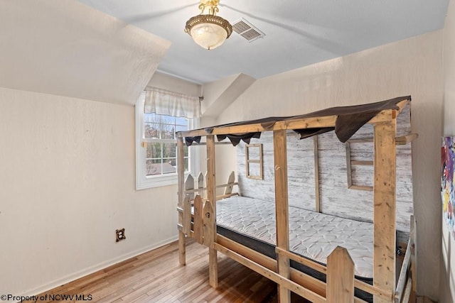 bedroom featuring wood-type flooring