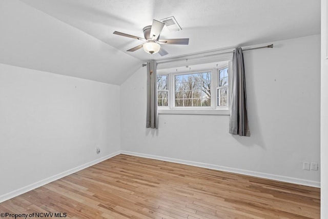 bonus room featuring ceiling fan, light hardwood / wood-style flooring, and lofted ceiling