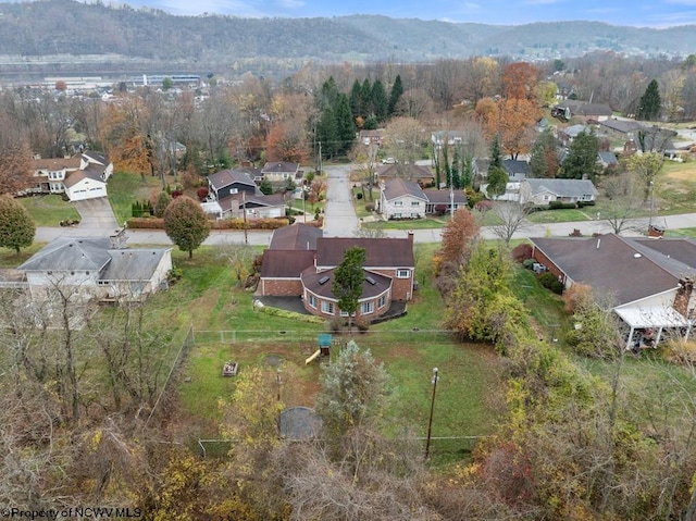 birds eye view of property with a mountain view