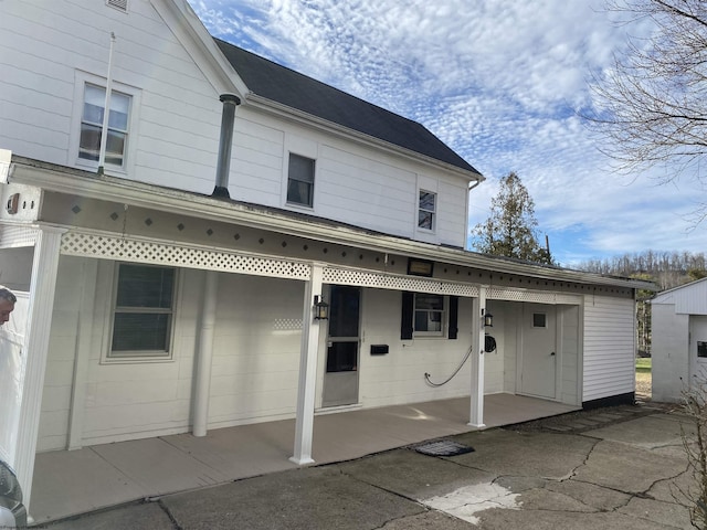 back of property featuring a patio