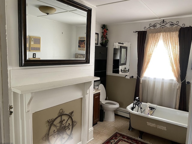 bathroom with a washtub, vanity, toilet, and baseboard heating