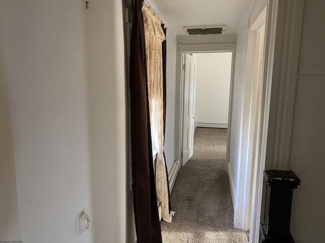 corridor featuring carpet and a baseboard radiator