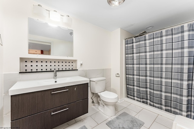 bathroom featuring decorative backsplash, toilet, tile walls, and vanity