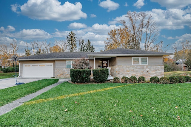 ranch-style home with a garage and a front lawn