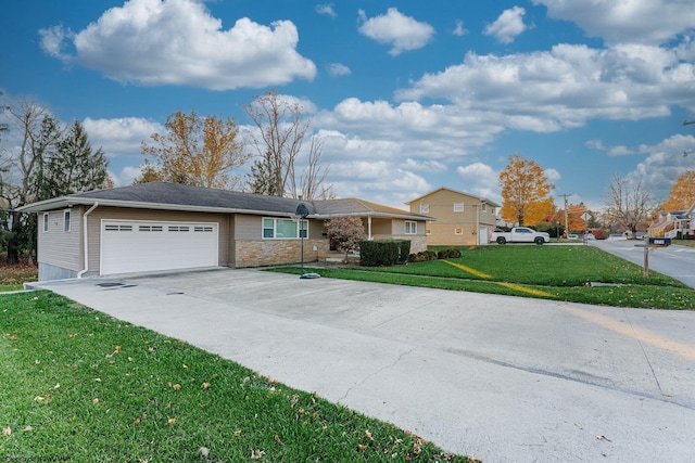 ranch-style home with a garage and a front lawn