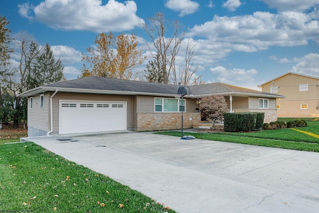 ranch-style home with a garage and a front lawn