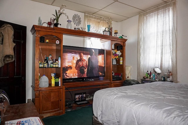 bedroom featuring a paneled ceiling