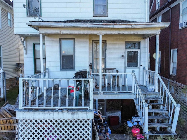 view of exterior entry with covered porch