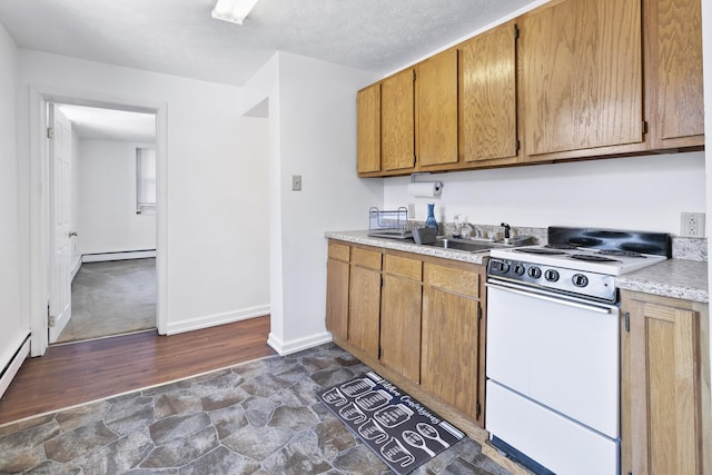 kitchen with a textured ceiling, white range, a baseboard radiator, and sink