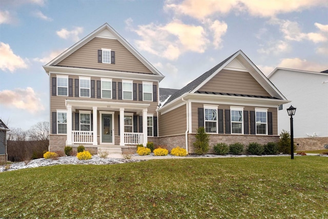 view of front of house featuring a front lawn and a porch