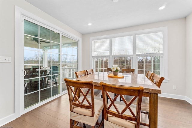 dining area with wood-type flooring