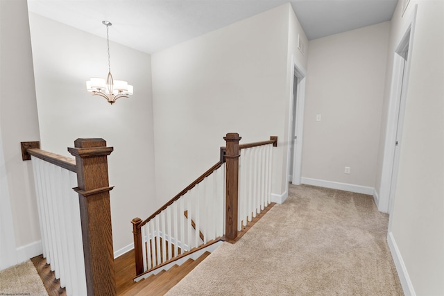 interior space featuring carpet flooring and a notable chandelier