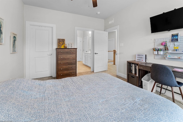 bedroom with ensuite bath and ceiling fan