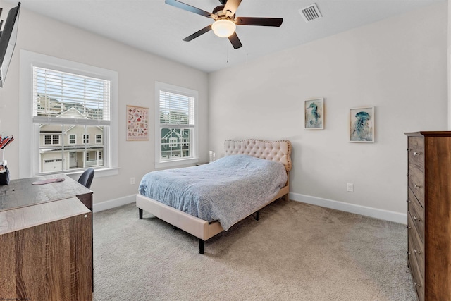 bedroom with ceiling fan and light colored carpet