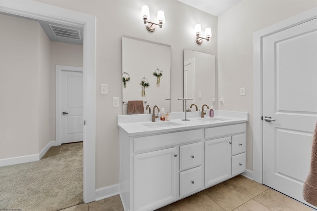 bathroom featuring tile patterned flooring and vanity