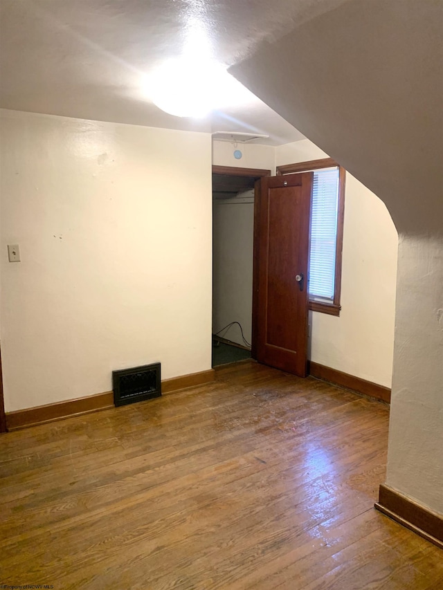 unfurnished room featuring hardwood / wood-style flooring