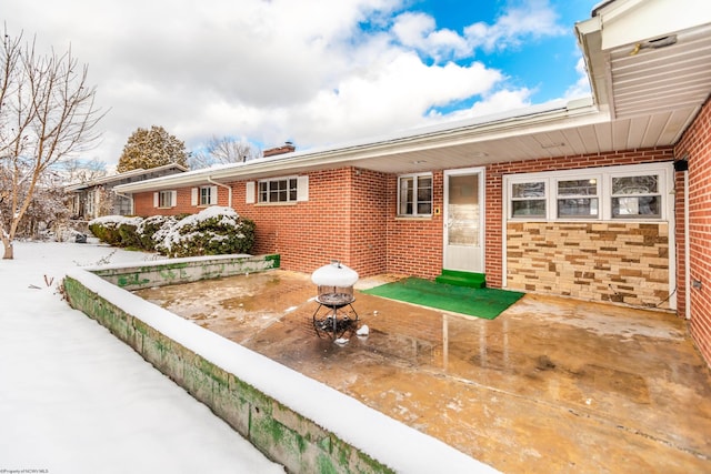 view of snow covered patio