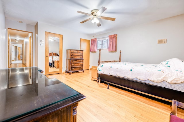 bedroom featuring wood-type flooring and ceiling fan