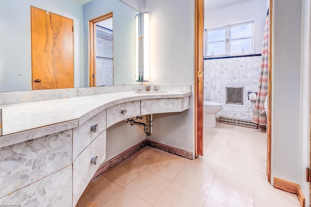 bathroom with tile patterned floors, sink, and toilet