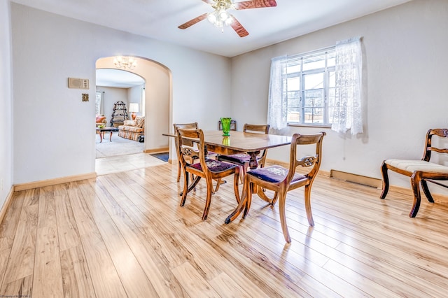 dining space with light wood-type flooring and ceiling fan