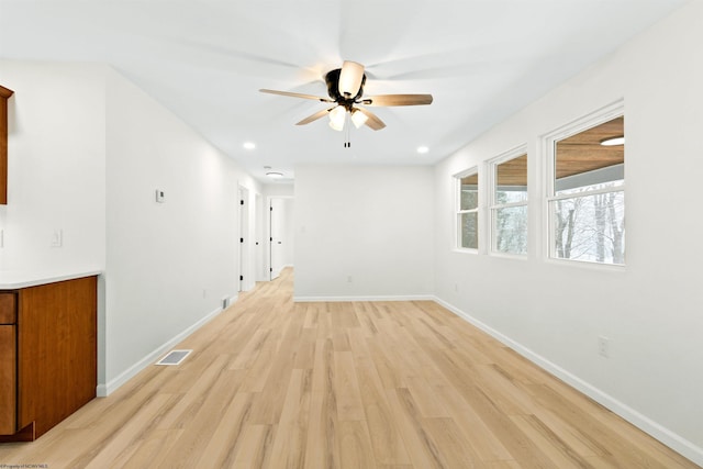 unfurnished room featuring ceiling fan and light wood-type flooring