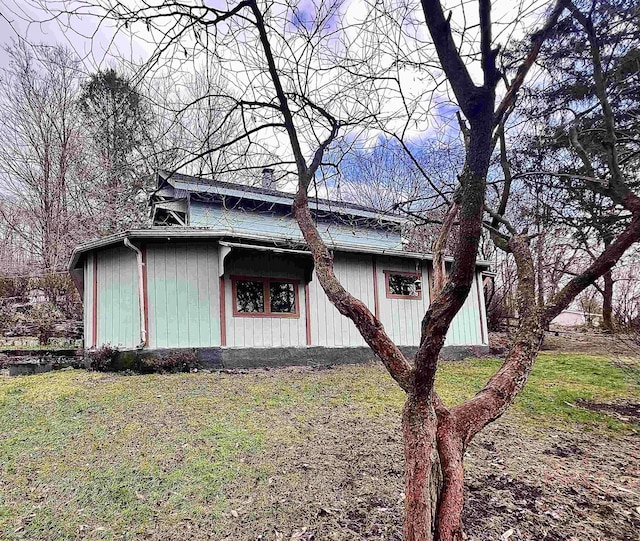 view of property exterior featuring a yard