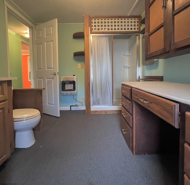 bathroom with heating unit, a shower, and toilet