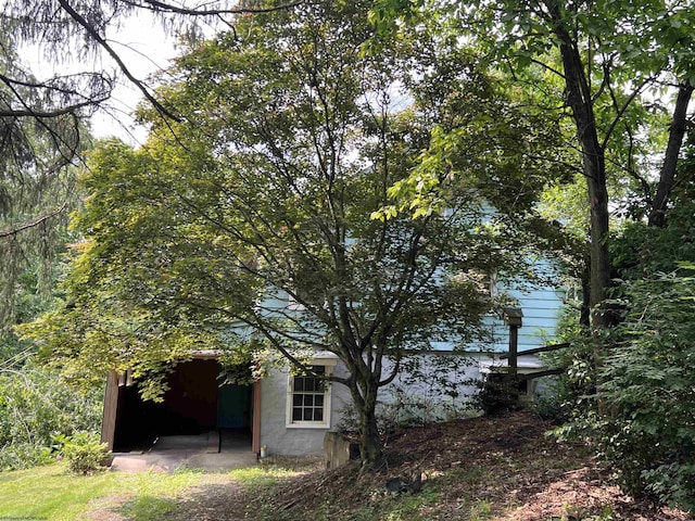 48 Booth Rd, Booth, WV 26501 - view of home's exterior with stucco siding