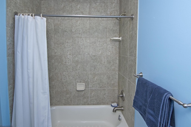 bathroom with shower / bathtub combination with curtain