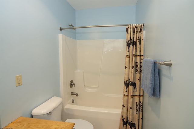 bathroom with shower / bathtub combination with curtain and toilet