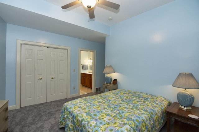 carpeted bedroom featuring ensuite bath, ceiling fan, and a closet