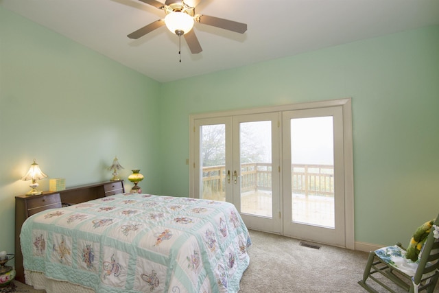 carpeted bedroom featuring access to exterior and ceiling fan