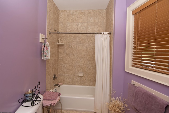 bathroom featuring shower / tub combo with curtain