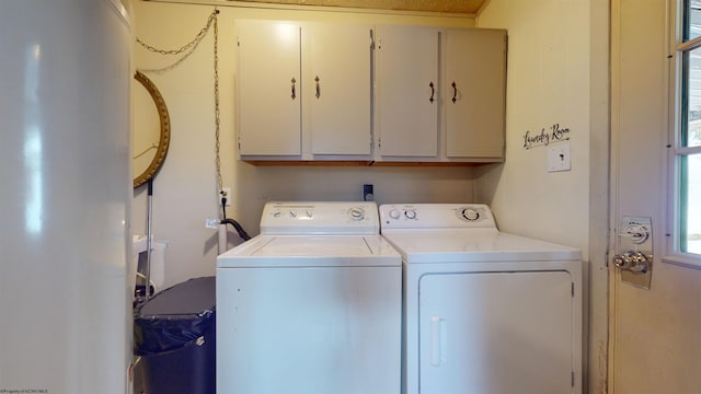 laundry area with cabinets and independent washer and dryer