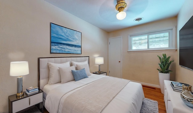 bedroom featuring ceiling fan and wood-type flooring